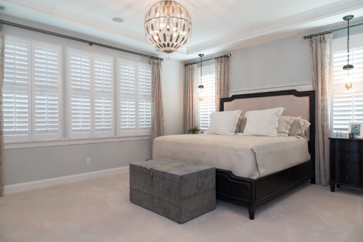White plantation shutters in a bedroom